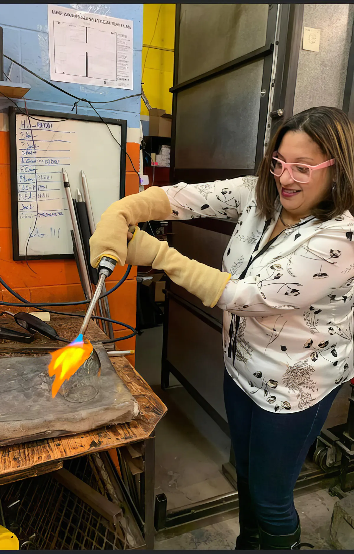 Invivyd employee Hilda Gonzalez working in a glassblowing studio